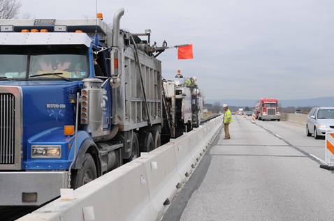 Construction vehicles working on roadway