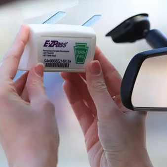E-ZPass transponder being placed on windshield