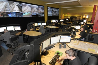 Operations center overview with multiple computer screens