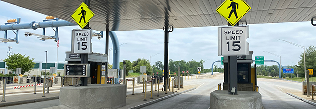 Toll Point with 15 MPH speed limit signs