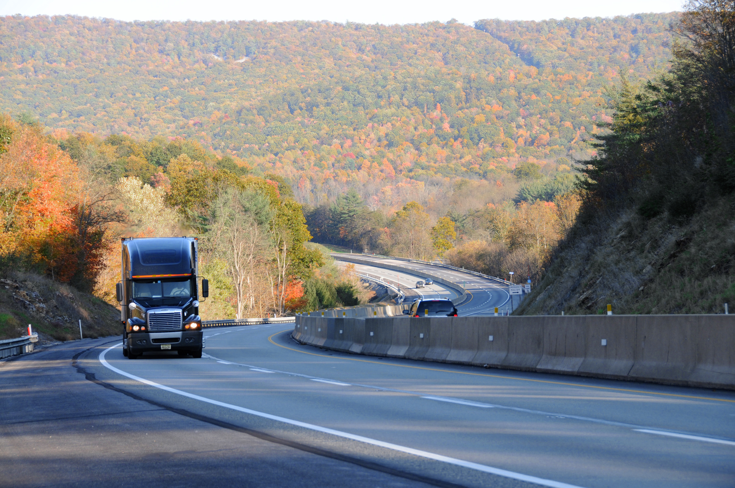 Road curving though landscape in autumn