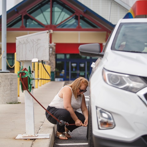 Motorist inflating tires