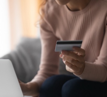 Woman holding a credit card