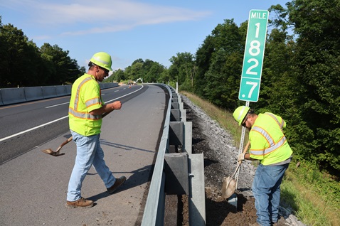 Burnt Cabins July 2025-003 1 Workers installing mile post sign