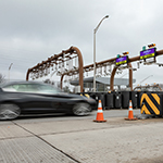 A car going through a Toll Point