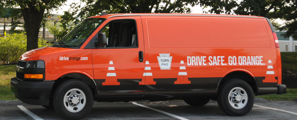 Drive Safe. Go Orange. Van with graphics
