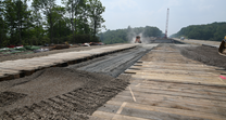 Widening for arch bridge construction