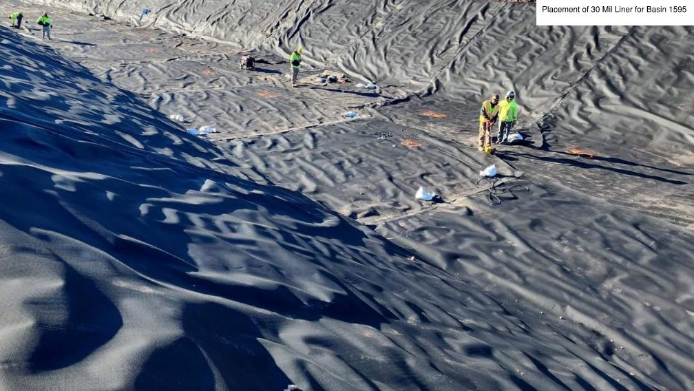 Placing Liner in Basin