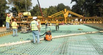Construction workers preparing the deck of the new Valley Hill Road Bridge